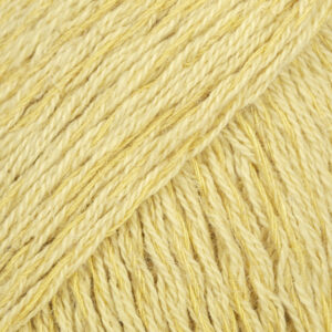 Yellow yarn with golden strands close up